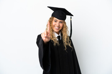 Wall Mural - Young university graduate isolated on white background showing and lifting a finger