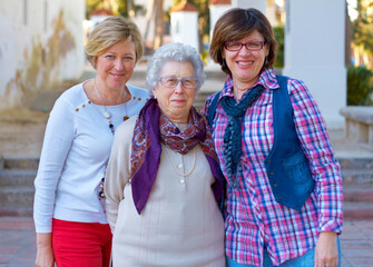 The three musketeers. Shot of three mature woman standing outdoors.