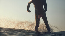 Silhouette Of A Person Surfing