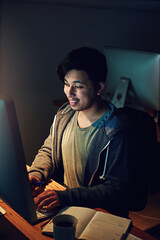 Leinwandbilder - Earning that extra buck on night shift. Cropped shot of a designer working on his computer on a night shift at work.