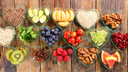 Wall Mural - diet food selection in heart shape bowl