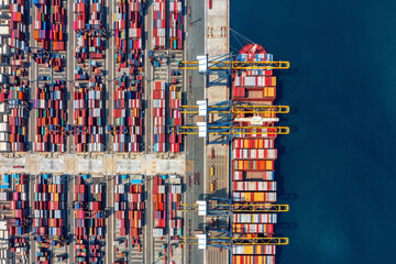 Wall Mural - Aerial view of cargo ship and cargo container in harbor.