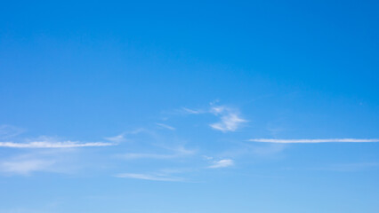 Wall Mural - white clouds and white smoke trail of air plane on the clear blue sky.