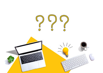 Question marks with computers and a light bulb