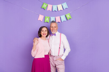 Poster - Portrait of two friendly elderly idyllic partners hug enjoy festive season isolated on violet color background