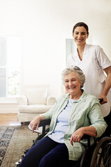 Canvas Print - Youre in good hands with her. Portrait of a smiling caregiver and a senior woman in a wheelchair at home.