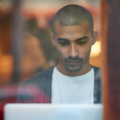 Aufkleber - Hes working on some new content for his blog. Cropped shot of a young man working on his laptop in a coffee shop.