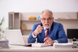 © Elnur - Old male employee working from home during pandemic