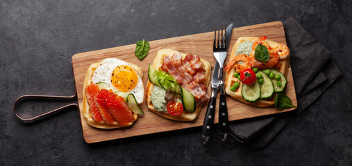 Poster - Breakfast waffles with fried eggs, salmon, cucumber and prawns