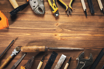 Wall Mural - Construction tools with a pattern on a wooden table