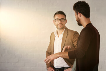 Poster - Discussing a few business ideas. Cropped shot of two businessmen having a conversation.