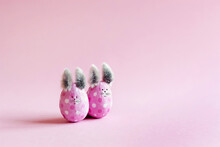 Pink Easter Eggs In The Form Of Bunnies On A Pink Background