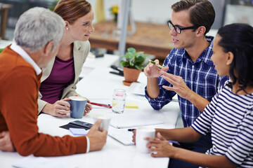 Poster - He always communicates his ideas well. A cropped shot of a group of professionals having a meeting at work.