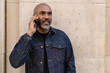© blvdone - Mature black man in cityMature black man in city talking on cell phone