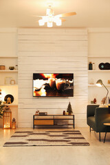 Sticker - Plasma TV on white wooden wall in living room beautifully decorated for Christmas