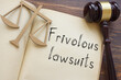 Frivolous lawsuits are shown on the photo using the text