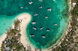 Drone aerial view of anchored sailing yacht in emerald Caribbean sea, Stocking Island, Great Exuma, Bahamas.