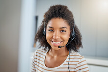 There Are Various Ways You Can Get In Touch. Portrait Of A Young Woman Wearing A Headset While Working On A Computer At Home.