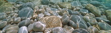 Pebbles And Rocks Under Water In The Sea, Natural Scene, Mediterranean Sea, Spain