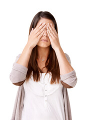 Poster - See no evil. Casually dressed young woman with her hands covering her eyes.