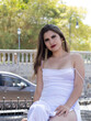 © Didier - young latina woman in white dress in San Jose Costa Rica on a sunny and windy summer day. sexy free and successful college woman. copy space and background blur.