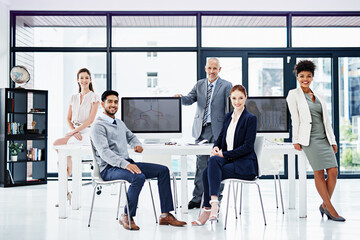 Aufkleber - Our office is a open and communicative environment. Portrait of a group of businesspeople standing together.