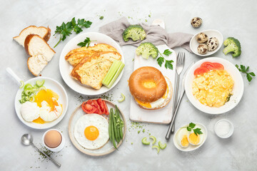 Wall Mural - Various ways of cooking chicken eggs on light background.