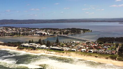 Wall Mural - Fast aerial panning facing Lake Tuggerah entrance at The Entrance in 4k.
