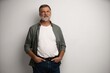 © opolja - Portrait of smiling mature man standing on white background