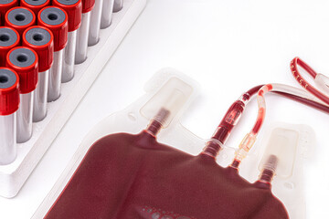 Wall Mural - A bag of blood and a rack of blood tubes on a white background.