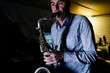 © Westend61 - Musician playing saxophone practicing in recording studio
