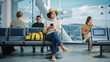 © Gorodenkoff - Airport Terminal: Diverse Multi-Ethnic Crowd of People Wait for their Flights, Use Mobile Smartphones to Browse Interner, Post Vacations Photos on Social Media. Boarding Lounge of Big Airline Hub