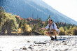 © Westend61 - Austria, Alps, man on a hiking trip having a cooling break at a brook
