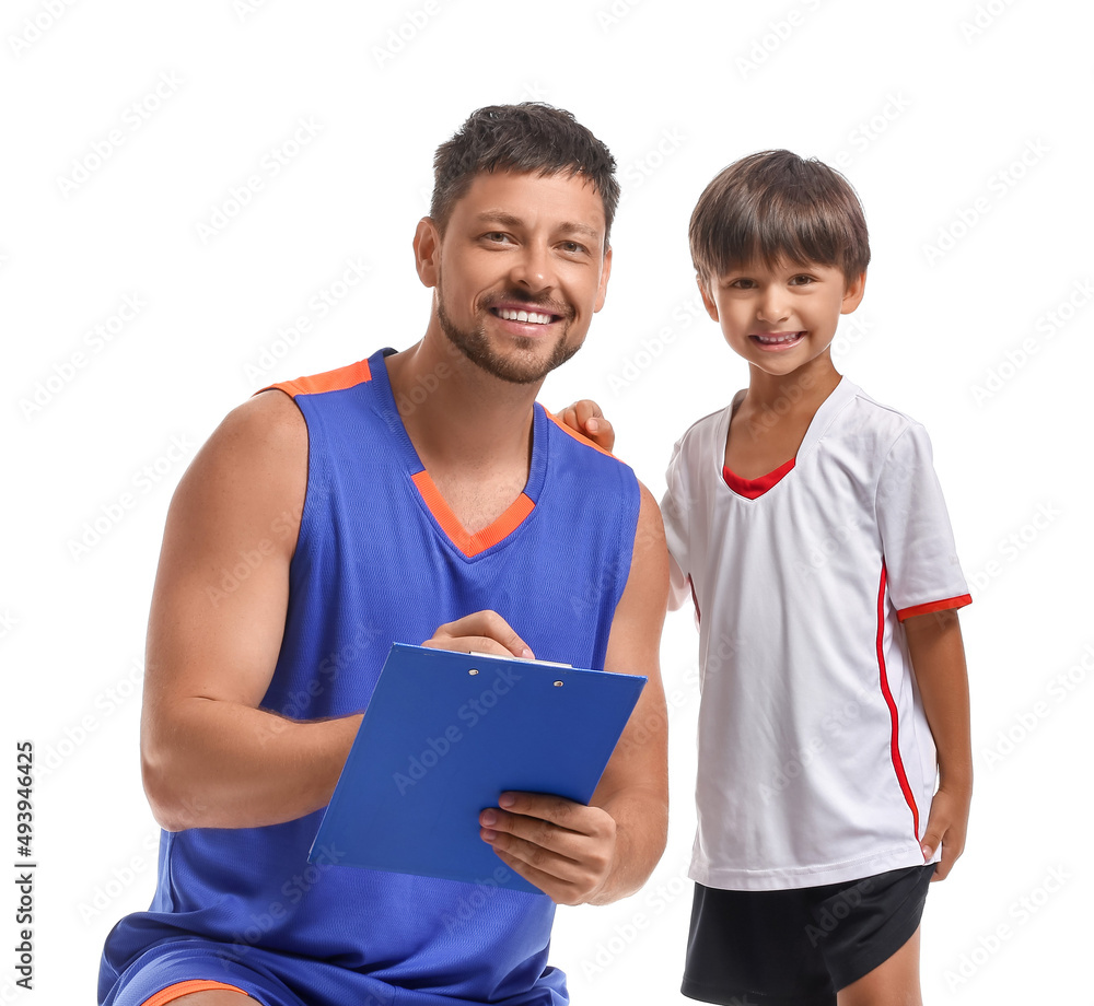 Basketball player writing in clipboard and his little trainee on white background