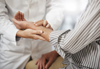 Canvas Print - Lets check your pulse. Cropped shot of an unrecognizable female doctor taking a male patients pulse during a consultation.