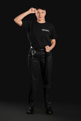 Wall Mural - Female security guard on dark background