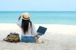 Lifestyle freelance woman  using laptop working and relax on the beach. Asian people success and together your work pastime and meeting conference on internet in holiday. Business and Summer Concept