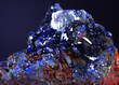 Close-up shot of azurite stone mineral specimen isolated on gray background