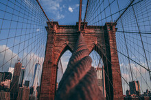 Close-up Shot Of A Rope Connected To The Brooklyn Bridge.