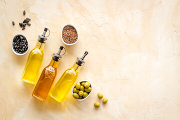 Different kind of cooking oil - sunflower olive and sesame oil with seeds