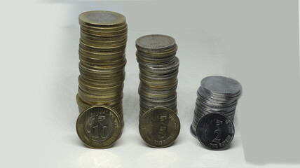 Closeup shot of Indian ten, five and two rupee coins isolated on white background