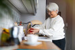 © pikselstock - Shot of a senior woman in her kitchen