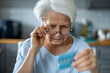 © pikselstock - Senior woman about to take her medication