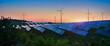 panoramic view of photovoltaic panels and wind turbines in the light of the rising sun, clean energy concept