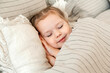 © etonastenka - Charming little girl sleeps in bed. Little blonde sleeps sweetly in bed with white linen. place for text. healthy child