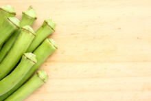 Background With Raw Green Okra On Wood With Copy Space