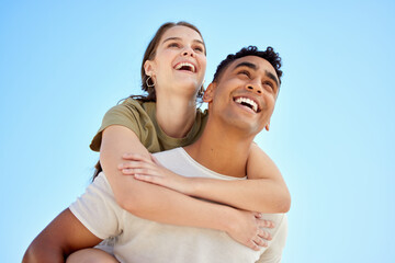 Wall Mural - Summer is our favourite season. Shot of a young couple enjoying a day at the beach.