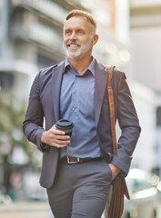 Sticker - I can feel the caffeine in my veins. Shot of a handsome mature businessman walking around town drinking coffee.