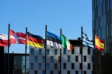 Group Of EU Memberstate Flags Waving In Wind Court Of Justice Building In Luxembourg: Denmark, Germany, Estonia, Ireland, Greece, And Spain