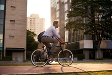 Commuting The Carbon-free Way. Shot Of A Businessman Commuting To Work With His Bicycle.
